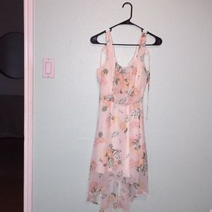 Floral dress with small trail.